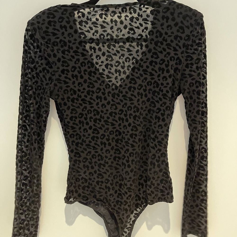 ASTRA black sheer textured body suit.